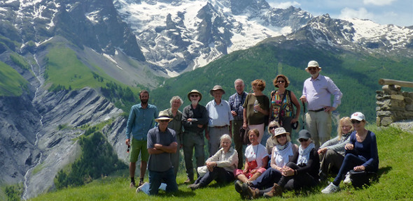 Group of adults on a hiking trip with mountains in the background